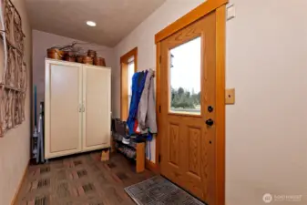 This is the side door near the garage. You enter into a "mud room" where you can hang your coat and drop your shoes, then step into the main living room.