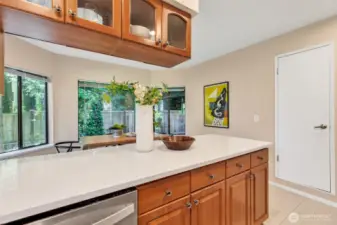 Discreetly placed pantry behind a sleek door to the right
