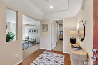 Spacious entry with hardwood floors.