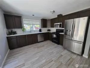 Sleek kitchen design showcases stainless steel appliances, modern fixtures, and abundant cabinetry. An ideal blend of form and function for any home chef.
