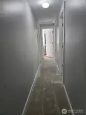 Upstairs hallway leading to bedrooms and shared bathroom