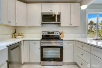 Brand-new built-in cupboards and cabinets offer ample, convenient storage—designed to keep everything organized while enhancing the kitchen’s clean, modern look. The undercounter lighting is an elevated touch.