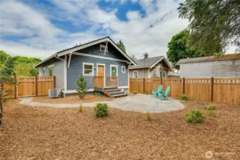 Enjoy the benefits of a thoughtfully redesigned landscape featuring fresh plantings, natural wood chip ground cover, brand-new fencing, elegant flagstone patio and walkways—and plenty of space to create your dream garden beds.