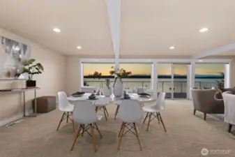 An open and airy main floor complete with powder bath, laundry, kitchen with dining space, and living room.