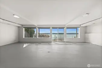 The largest waterside flex room in the partially finished basement —ideal as a home gym, theater, or bonus space—featuring fresh paint, large windows, and endless possibilities.
