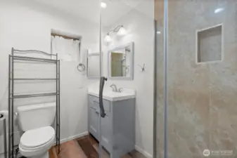 A refreshed 3/4 bath tucked at the hall’s end for added privacy.