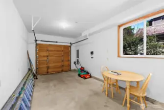 Single car garage with sliding window.
