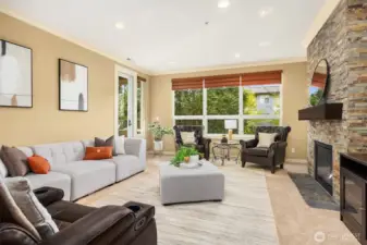 the large living room open to the kitchen & dining areas