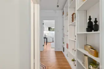 From front door, looking down hall towards bedroom- door on the left is the full bathroom