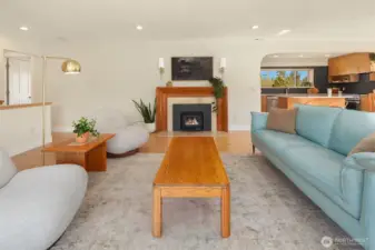 Living space with fire place. Fire added for visual, buyer to verify functionality.