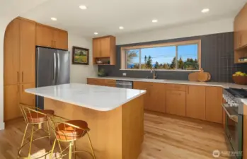 Kitchen with ample storage & views.
