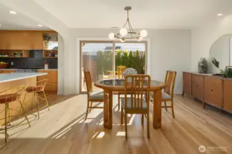 Dining area with new sliding glass doors leading to outdoor patio.