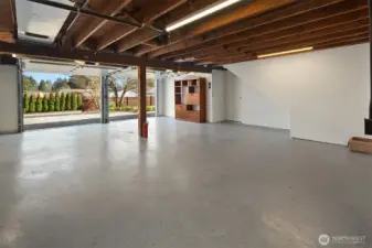 Spacious 2 car garage with alley access and additional driveway parking.