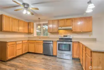 Kitchen showcasing updated granite counters