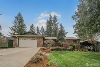 Welcome home! Inviting curb appeal with a welcoming entry and well-maintained landscaping.