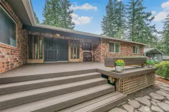 Entry features a spacious front porch that beautifully showcases the home’s classic brick exterior.