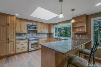 A spacious kitchen offers the perfect space for cooking, gathering, and entertaining.