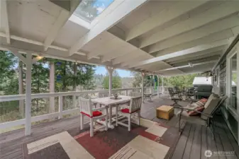 Expansive covered deck creates the perfect setting for outdoor entertaining and relaxing year-round.