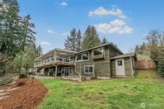 Attached storage shed with backyard access.
