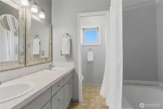The primary bathroom offers double vanities, plus bath, and seperate toilet area.