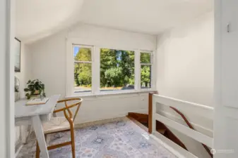 The upstairs landing has space for a desk, or ?