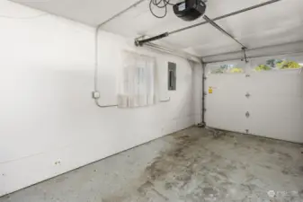 Inside of the single car garage. Washer and dryer behind photographer.