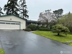 Tons Of Parking Here! 2-Car Garage, Huge Driveway PLUS Off Street Parking In Front!