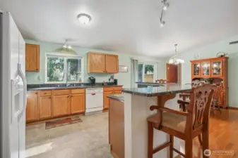 Granite countertops, peaceful scenery out kitchen and dining windows