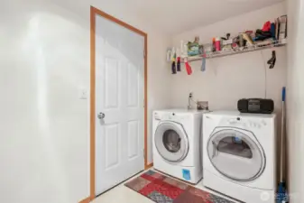 Utility room conveniently located off garage.