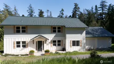 Front of home, two car garage on right