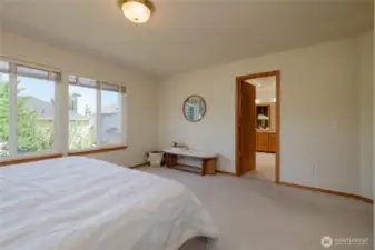 The spacious primary suite is a true retreat, filled with natural light that enhances its calming ambiance. With ample room for a king-sized bed and a separate sitting area, this suite offers the perfect blend of comfort and functionality.