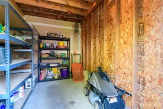 Located on the back of the home-this integrated shed easily holds all your garden tools, mowers and provides lots of extra storage room. The upper loft provides additional storage, as well. Perhaps finish the room and make it a home office or workspace!?