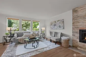The living room showing off the natural light and warm hardwood flooring.