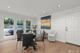 Generous North windows show off the backyard from the casual eating space.