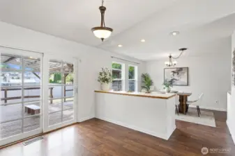 Dining table space just off the sliding doors that lead out to the covered deck.