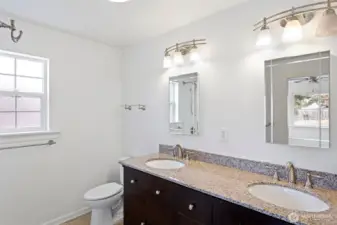 Primary private bath with walk in close attached, double since and large tub.