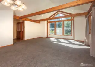 Large windows bring in the light from the front yard.