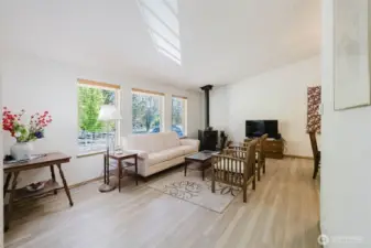 Light & bright Living area with wood fireplace for those cozy winter nights & days.