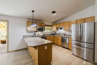 Kitchen w/stainless steel appliances.