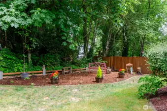 This level, sunny area backs up to a natural area, which is also part of the property.