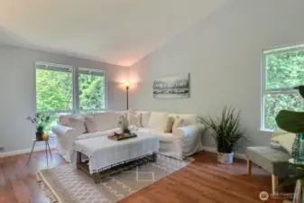 Vaulted ceilings and big windows enhance the living room
