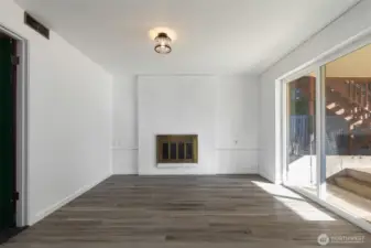 Lower level - ideal for multi generational living or create a M-I-L style suite. This room opens to covered patio and level, fenced back garden