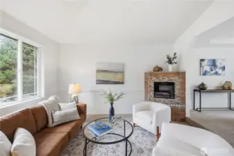 Front formal living, opening to formal ddning room