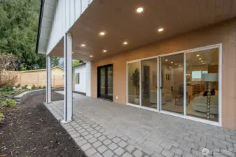 Wow - what a covered patio!!  With access from the sliders and French doors!