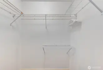 Walk-in closet in primary bedroom