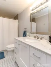 Marble vanity with ceramic tile floor