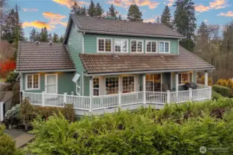 Wrapapround deck with access from the living room and primary suite