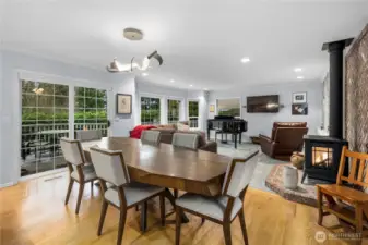 Elegant hardwood floors grace the entry and open concept kitchen and dining room.