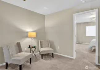 Versitile loft area leading into primary suite