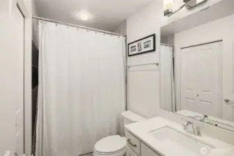 A full en-suite bathroom complements the room, providing a private and personal retreat.